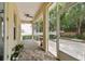 Screened patio with brick flooring, a ceiling fan, and views of the backyard at 4206 W Sevilla St, Tampa, FL 33629