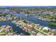 Stunning aerial view of waterfront homes showcasing access to bay, docks, and lush landscaping at 4425 13Th Ne Way, St Petersburg, FL 33703