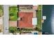 Aerial view showcasing a waterfront home with a boat dock along a canal in a quaint residential neighborhood at 4425 13Th Ne Way, St Petersburg, FL 33703