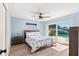 Light blue bedroom with waterfront views offers lots of natural light and privacy at 4425 13Th Ne Way, St Petersburg, FL 33703
