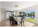 Dining room overlooking waterfront canal with sliding glass doors and lots of natural light at 4425 13Th Ne Way, St Petersburg, FL 33703