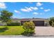 Beautiful single-story home featuring a red tile roof, lush landscaping, and a brick paved driveway at 4425 13Th Ne Way, St Petersburg, FL 33703