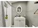 Bathroom with white vanity, walk-in shower and gray walls at 4465 56Th N Ave, St Petersburg, FL 33714
