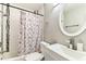 Bathroom features a shower with a new curtain and modern sink at 4465 56Th N Ave, St Petersburg, FL 33714