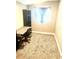 Bedroom featuring a desk and chair placed near a window, complimented by a dark bookshelf for extra storage at 4465 56Th N Ave, St Petersburg, FL 33714