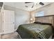 Comfortable bedroom with a large bed and a ceiling fan and exterior view at 4465 56Th N Ave, St Petersburg, FL 33714
