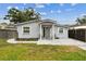 Charming single-story home with a well-maintained lawn and inviting front porch at 4465 56Th N Ave, St Petersburg, FL 33714