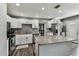 Modern kitchen featuring white cabinets, granite countertops, and stainless steel appliances at 4465 56Th N Ave, St Petersburg, FL 33714