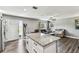 Open-concept kitchen and living area boasts an island and lots of natural light at 4465 56Th N Ave, St Petersburg, FL 33714