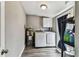 Laundry room with updated washer and dryer, and water heater at 4465 56Th N Ave, St Petersburg, FL 33714