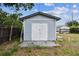 Backyard shed with double doors and concrete foundation at 4465 56Th N Ave, St Petersburg, FL 33714