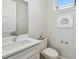 Clean half bath with a white vanity, modern fixtures, and a neutral color scheme, perfect for guests at 4757 Legacy Park Dr, Tampa, FL 33611