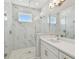 Elegant bathroom with a frameless glass shower and modern fixtures at 4757 Legacy Park Dr, Tampa, FL 33611