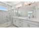 Modern bathroom featuring a glass shower, double vanity, and stylish fixtures at 4757 Legacy Park Dr, Tampa, FL 33611