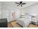 Comfortable bedroom with hardwood floors and ensuite bathroom at 4757 Legacy Park Dr, Tampa, FL 33611