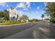 Gated community entrance with landscaped grounds, guard house, and secure access for residents and visitors at 4757 Legacy Park Dr, Tampa, FL 33611