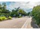 Community entrance with a gated entry, landscaped surroundings, and paved brick driveway for a welcoming arrival at 4757 Legacy Park Dr, Tampa, FL 33611