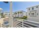 View from balcony of neighboring townhomes, featuring palm trees and blue sky at 4757 Legacy Park Dr, Tampa, FL 33611