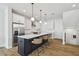 Bright kitchen with a large island, modern pendant lighting, and stainless steel appliances, great for entertaining at 4757 Legacy Park Dr, Tampa, FL 33611