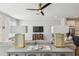 Stylish living room with modern decor, including unique lamps, a flat-screen TV, and comfortable seating at 4757 Legacy Park Dr, Tampa, FL 33611
