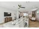 Open-concept living space featuring a modern kitchen, dining area, and comfortable lounge, perfect for Gathering gatherings at 4757 Legacy Park Dr, Tampa, FL 33611