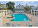 Community pool features clear water, comfortable lounge chairs, and a relaxing spa, all surrounded by well-maintained brick pavers at 4757 Legacy Park Dr, Tampa, FL 33611