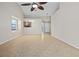 Spacious living area with high ceilings, tile floors, and a pass-through to the kitchen at 5100 Burchette Rd # 3005, Tampa, FL 33647