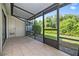 Covered and screened outdoor patio has tile flooring with a view of the backyard at 5100 Burchette Rd # 3005, Tampa, FL 33647