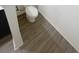 Stylish wood-look flooring enhances the look of the bathroom at 5310 Companion Ln, Tampa, FL 33619