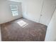 Bedroom has plush carpeting, a window, and closet doors at 5310 Companion Ln, Tampa, FL 33619