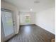 Bright and airy bedroom with wood-look floors and lots of natural light at 5310 Companion Ln, Tampa, FL 33619