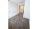 Upstairs loft featuring neutral walls and carpeted floors at 5310 Companion Ln, Tampa, FL 33619