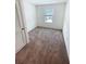 Cozy bedroom featuring a window, a closet, and neutral walls at 5310 Companion Ln, Tampa, FL 33619