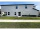 Exterior view of townhome, showing yard and entryway at 5310 Companion Ln, Tampa, FL 33619