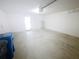 Clean, spacious garage with a water heater and lighting at 5310 Companion Ln, Tampa, FL 33619