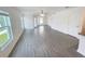 Spacious living room with wood-look floors and open floor plan at 5310 Companion Ln, Tampa, FL 33619