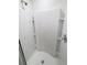 Modern walk-in shower with white tile and built-in shelving at 5310 Companion Ln, Tampa, FL 33619