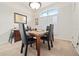 Bright dining room with large window and shutters, featuring a wood table with seating at 6237 Greenwich Dr, Tampa, FL 33647