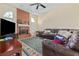 Relaxing living room with a brick fireplace, vaulted ceilings, and comfortable seating at 6237 Greenwich Dr, Tampa, FL 33647