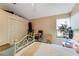Bedroom features a bed, closet and a large window at 625 Fayette S Dr, Safety Harbor, FL 34695