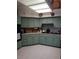 Functional kitchen with ample counter space, updated appliances, and classic tile flooring at 625 Fayette S Dr, Safety Harbor, FL 34695