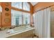 Bright bathroom with soaking tub and shower at 625 Fayette S Dr, Safety Harbor, FL 34695