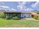 Expansive backyard with lush greenery, patio area, and well-maintained lawn perfect for outdoor living at 7107 Colonial Lake Dr, Riverview, FL 33578
