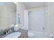 Bathroom featuring a granite countertop vanity, a toilet, and a shower-tub combination with tiled walls at 7107 Colonial Lake Dr, Riverview, FL 33578