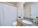 Well-maintained bathroom with a shower, single sink, and granite countertop at 7107 Colonial Lake Dr, Riverview, FL 33578