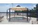 Community hot tub with a gazebo and lounge chairs in a fenced area at 7107 Colonial Lake Dr, Riverview, FL 33578