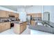 Spacious kitchen featuring a center island, stainless steel appliances, and ample cabinet space at 7107 Colonial Lake Dr, Riverview, FL 33578
