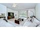 Spacious living room with a ceiling fan, plush sofas, and sliding glass doors to the outdoor space at 7107 Colonial Lake Dr, Riverview, FL 33578