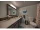 Modern bathroom featuring a sleek vanity with a gray cabinet and white marble countertop and matching backsplash at 712 Cordova Greens # 712, Largo, FL 33777