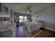 Cozy bedroom features ample natural light, hardwood floors, and view of the outdoors at 712 Cordova Greens # 712, Largo, FL 33777